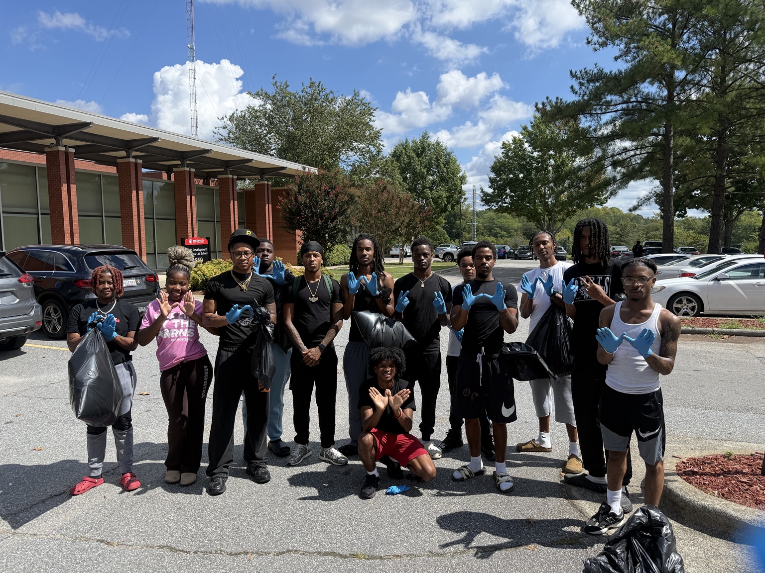 Community cleanup volunteers gathered outdoors