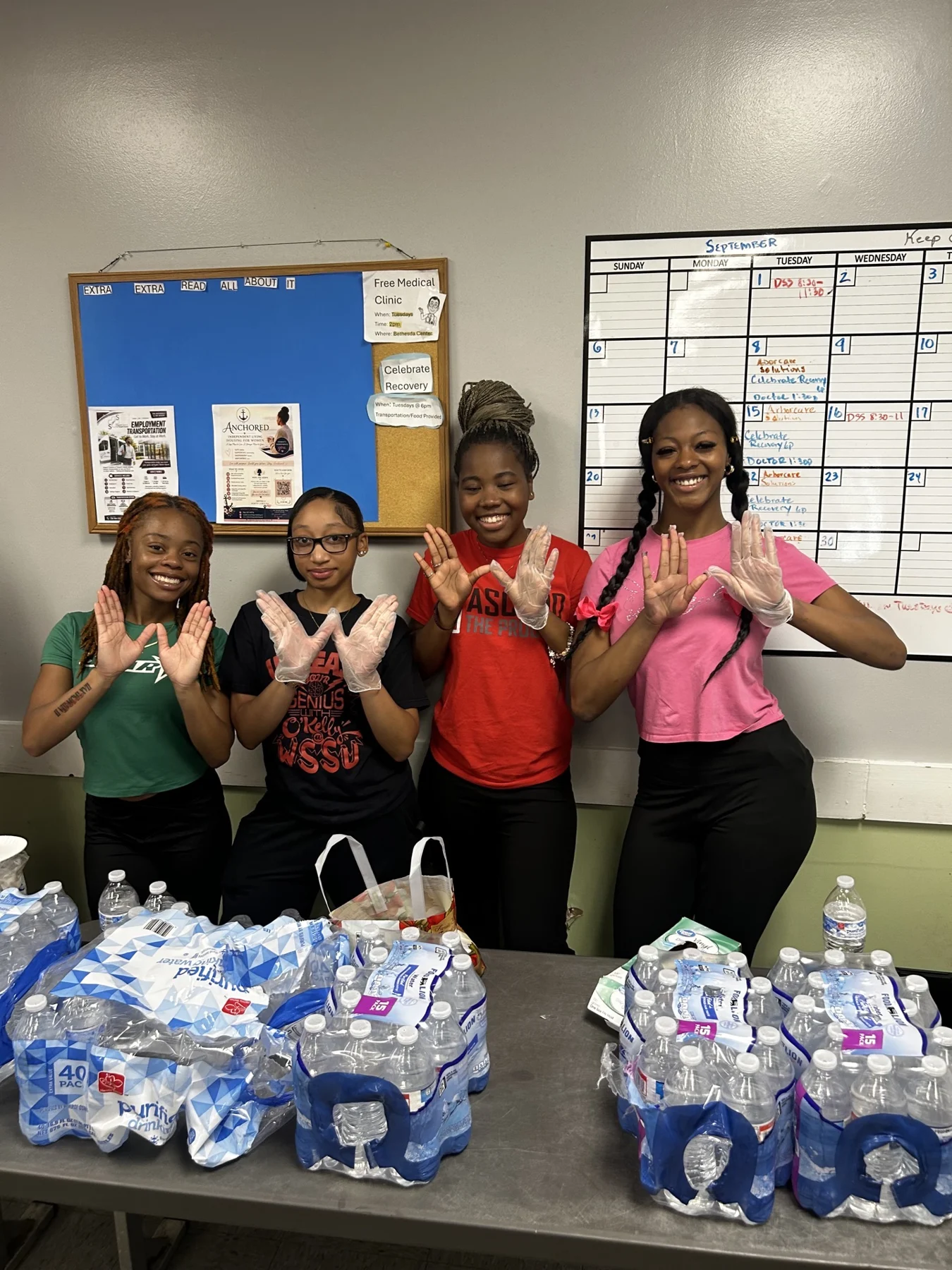 Community supply drive volunteers with donated water