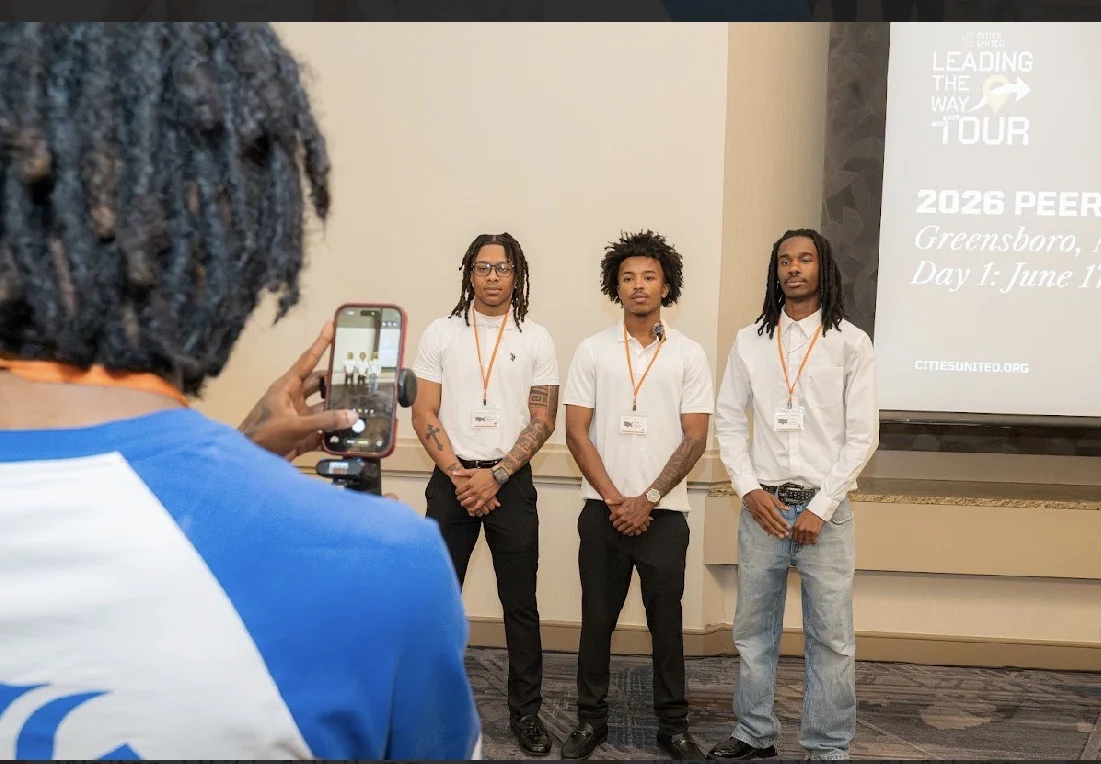 Three young leaders participating in a panel and presentation